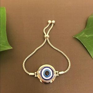 Silver beaded adjustable strap bracelet.